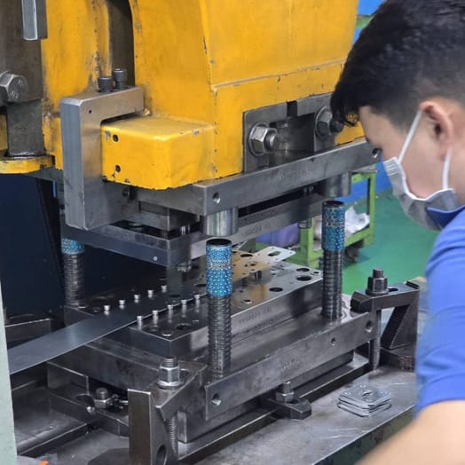 Progressive stamping tool in a press